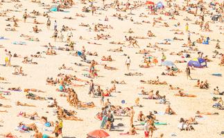 Summer in the city - photo of sand at Bondi Beach crowded with people in summer