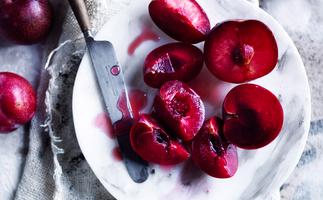 Plum recipes - Gourmet Traveller's best plum recipes. Photo of halved and quartered plums on a plate